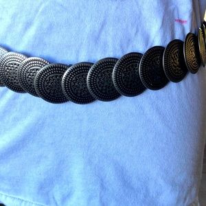 Expandable metal belt.